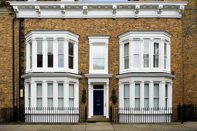 White sliding sash windows on a Victorian brick terrace